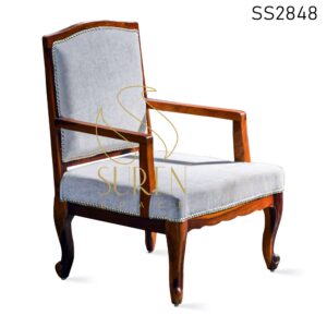 Carved Upholstered Teak Finish Rest Chair